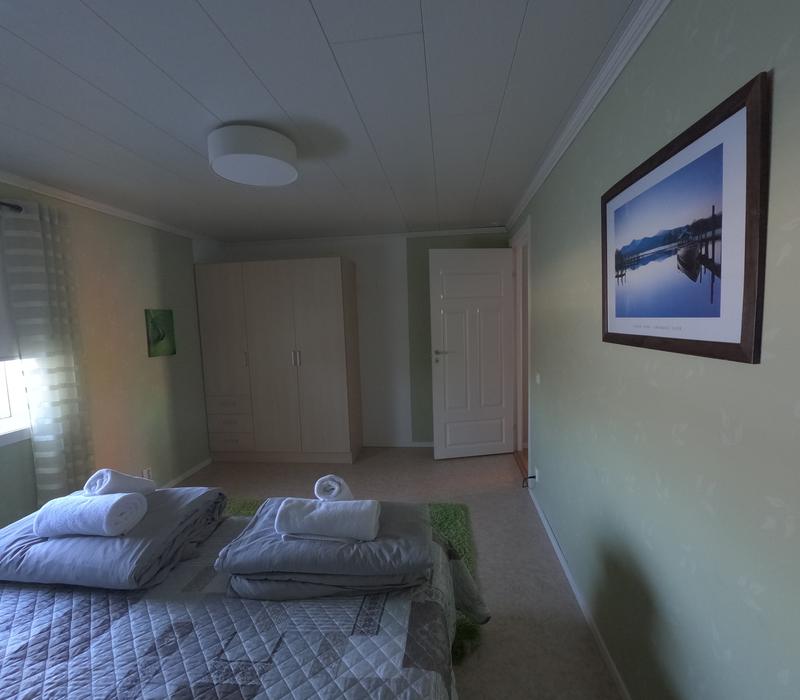 Master bedroom with wardrobe and artwork