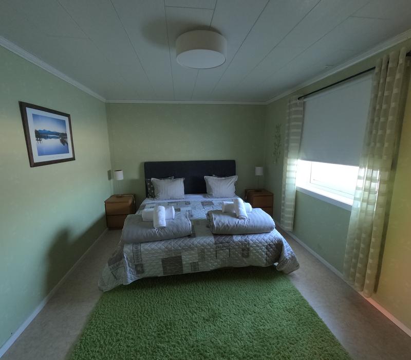 Spacious master bedroom with double bed